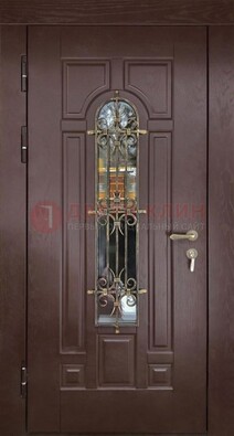 Темная железная дверь со стеклом и ковкой для частного дома ДСК-156 Кириши